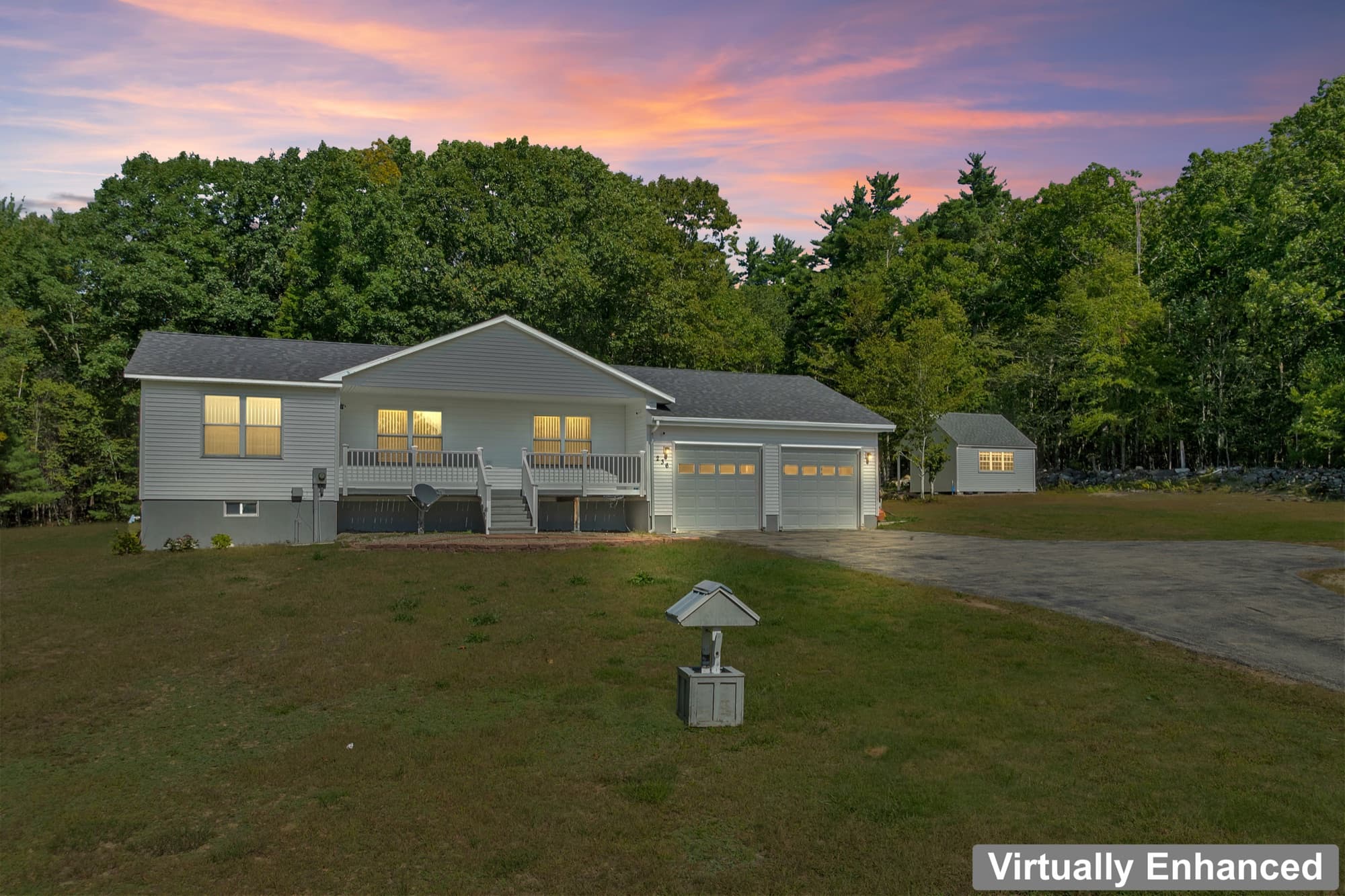 The house, the garage, and the studio out back across the lawn, by day and at dusk with the windows lit, at twilight